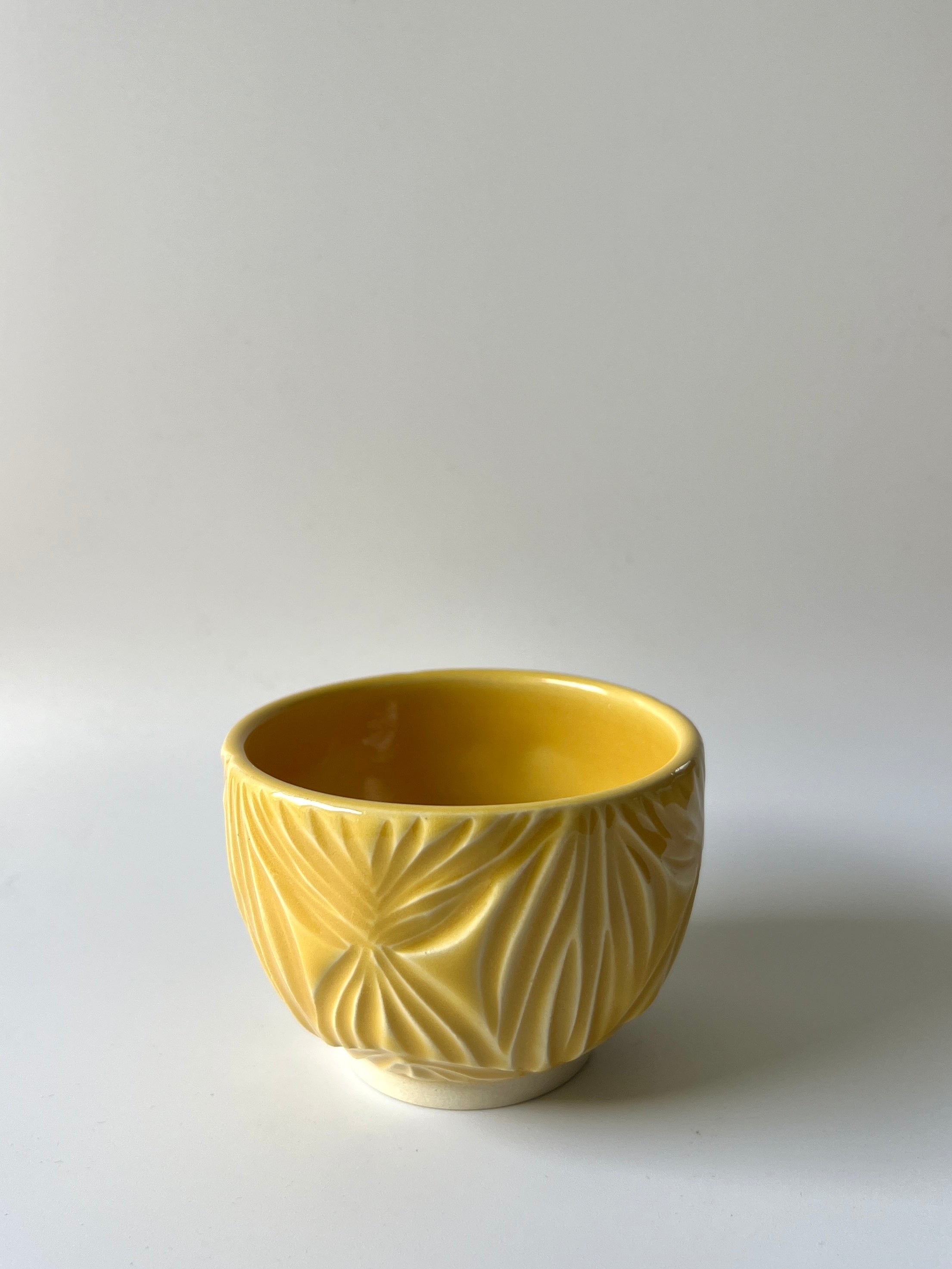 Sun-Drenched Carved Tea Cup